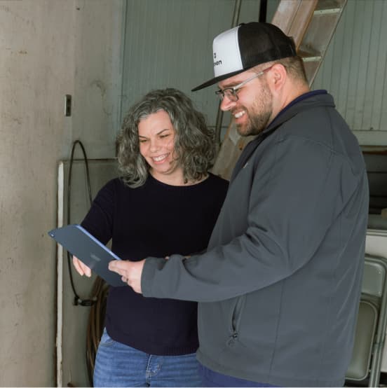 Woman speaking to haven representative about solar installation