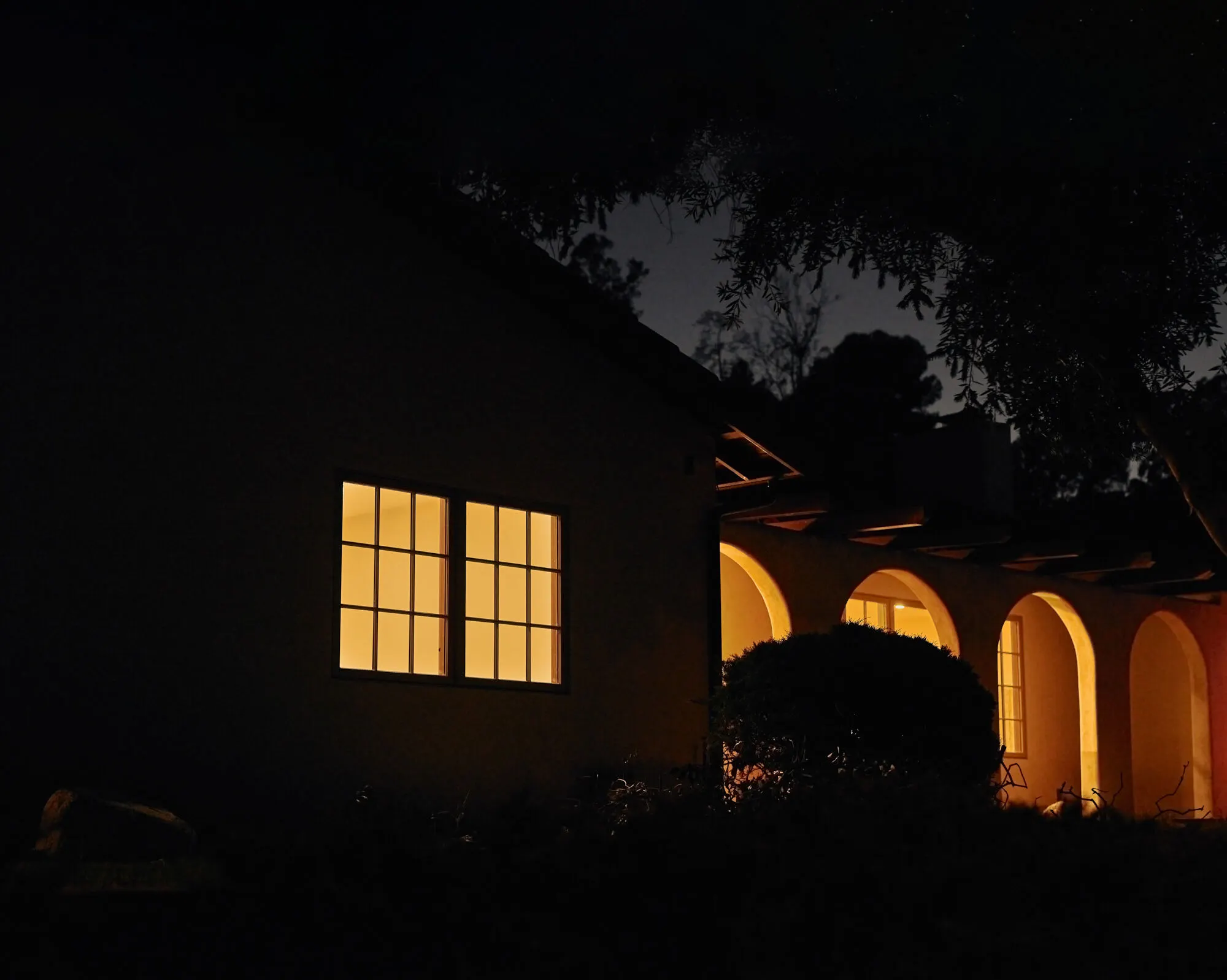 house with lights on at night