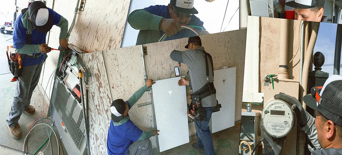 Electricians working on installing batteries